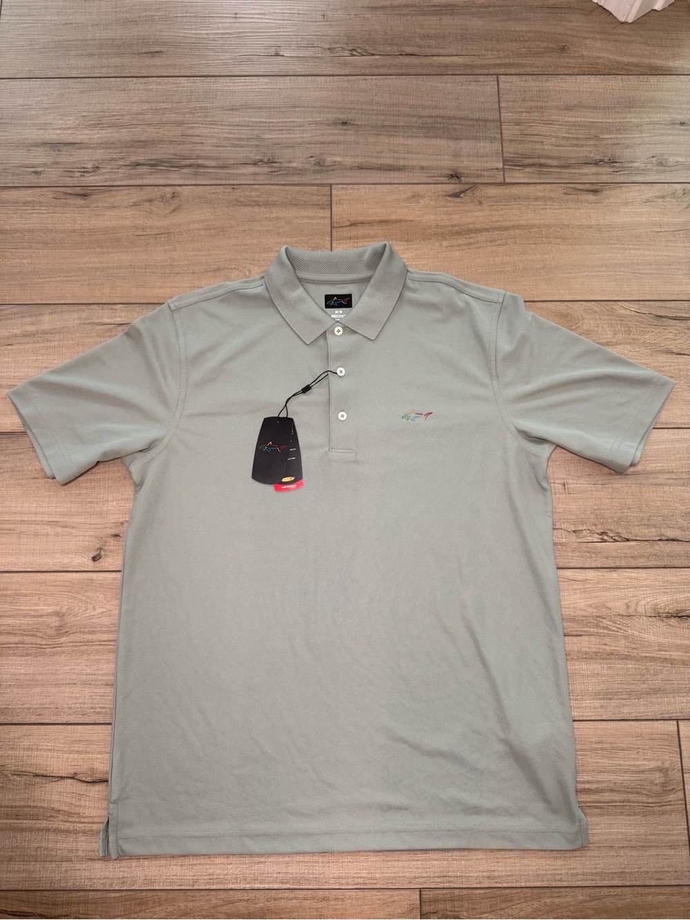 NWT Greg Norman Men’s M Green Performance Golf Polo Shark logo